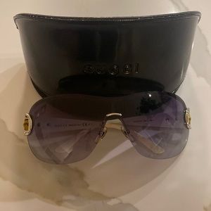 Gucci shield sunglasses with purple lenses, white arms and bamboo details